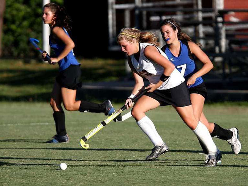 Girls playing hockey