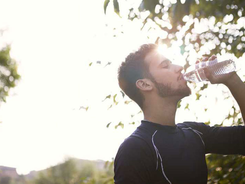 A man drinking water