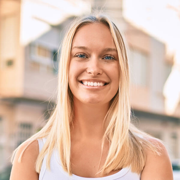 young woman smiling in the city