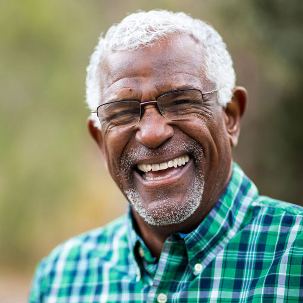 senior man smiling outdoors