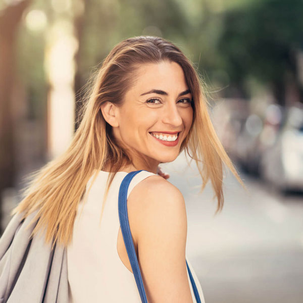 woman smiling in the city